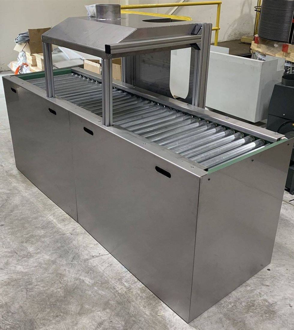 Stainless enclosure with roller table